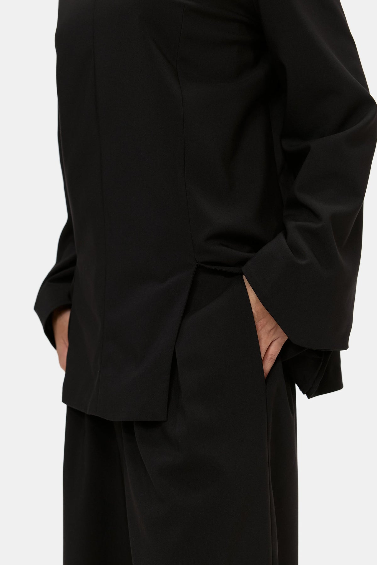 The Structured Top in Black, fabric and pocket detail