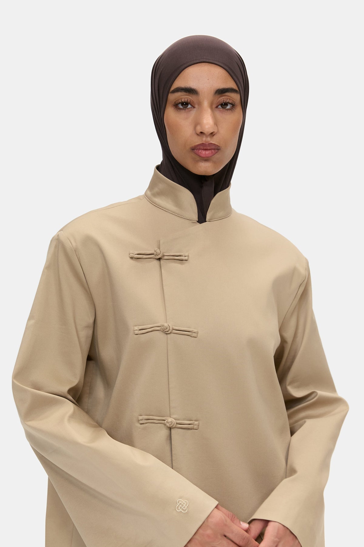 The Asymmetric Long Coat in Camel, closure detail