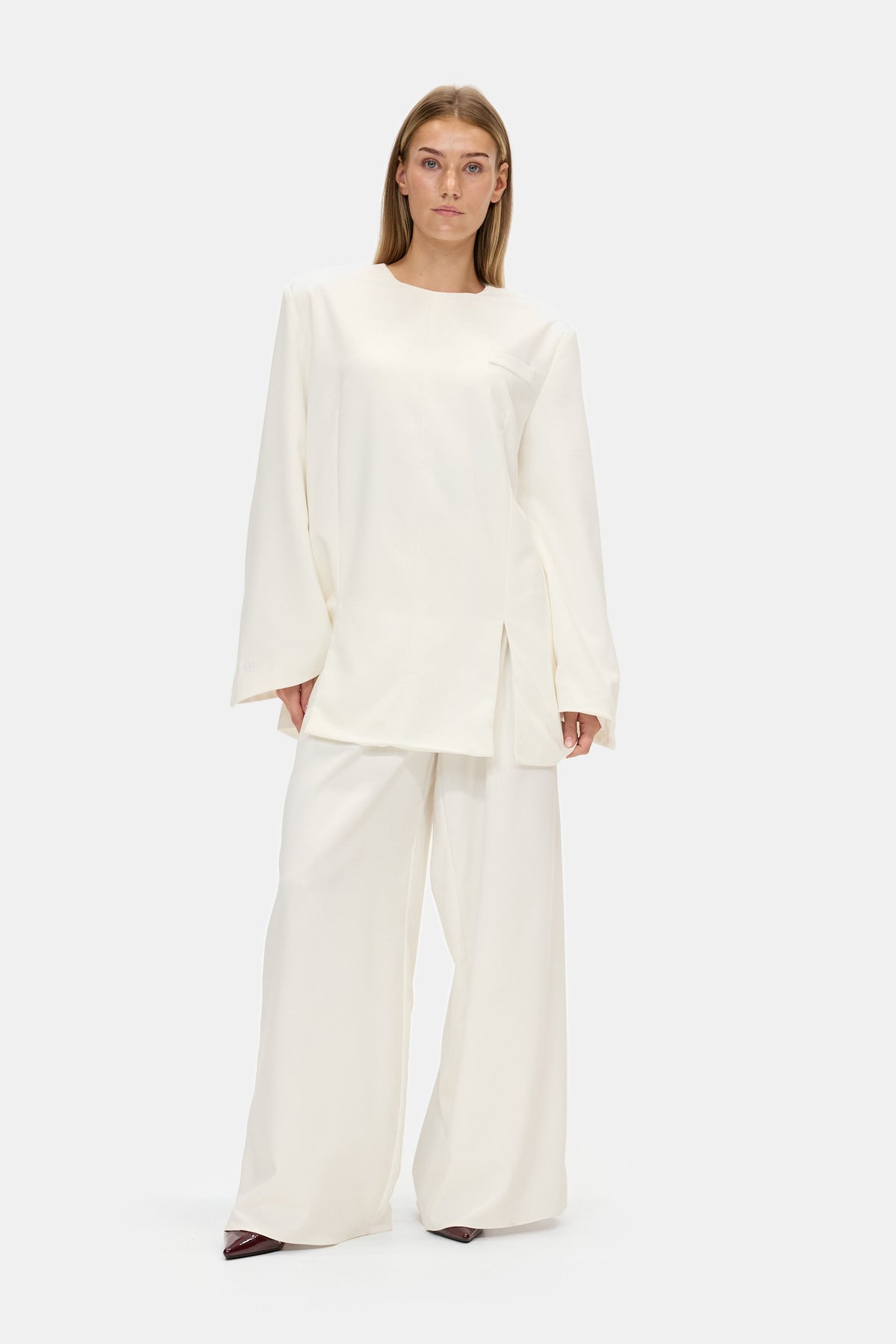The Structured Trousers in White, worn with the Structured Top