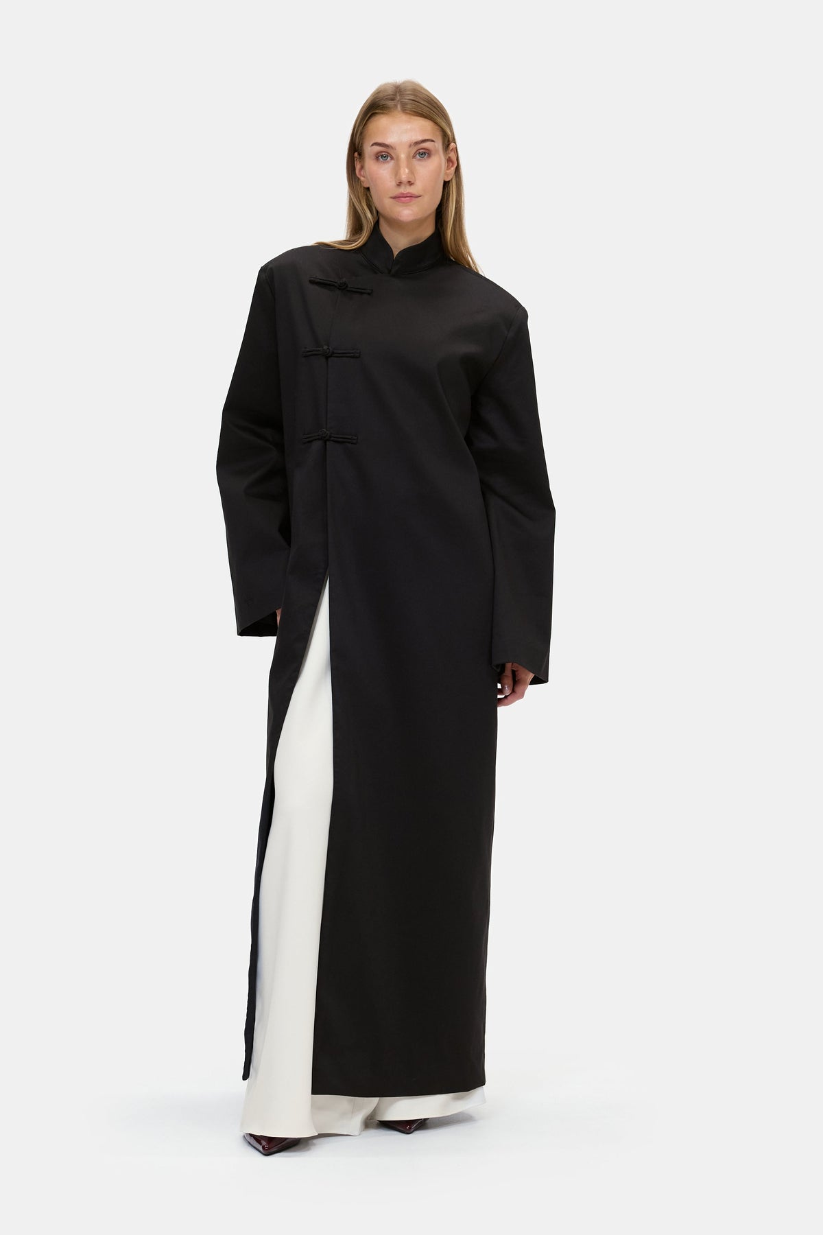The Asymmetric Long Coat in Black, front