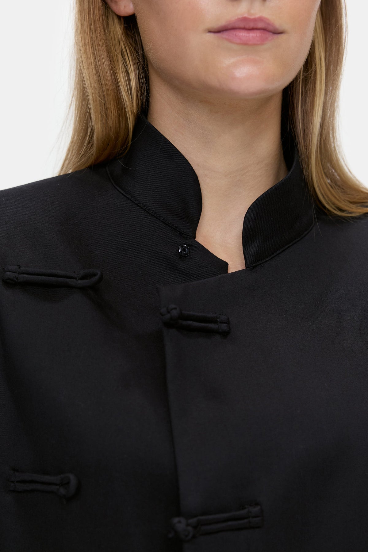 The Asymmetric Long Coat in Black, closure detail