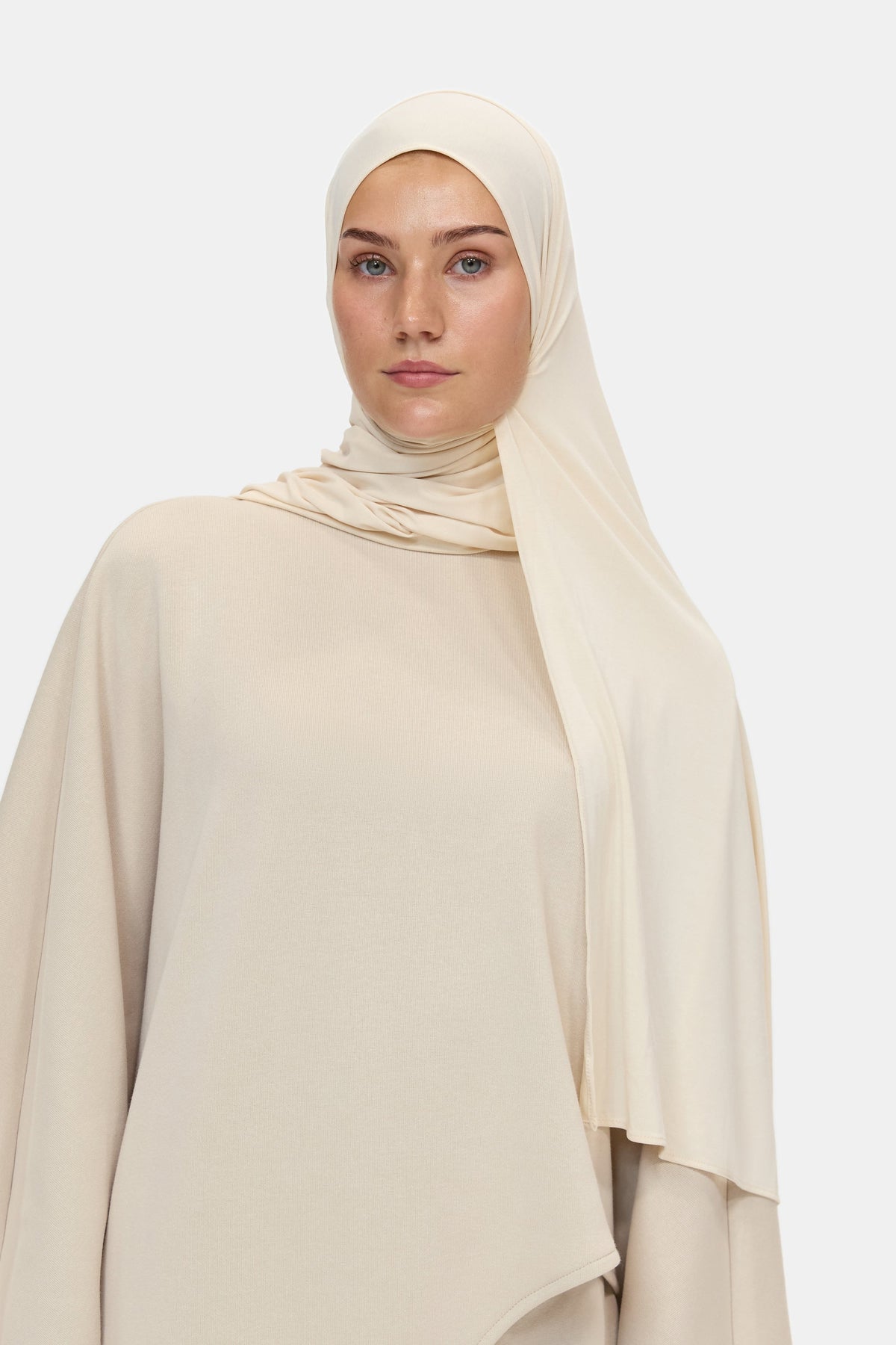 The Unique Set in Beige, styled with a scarf