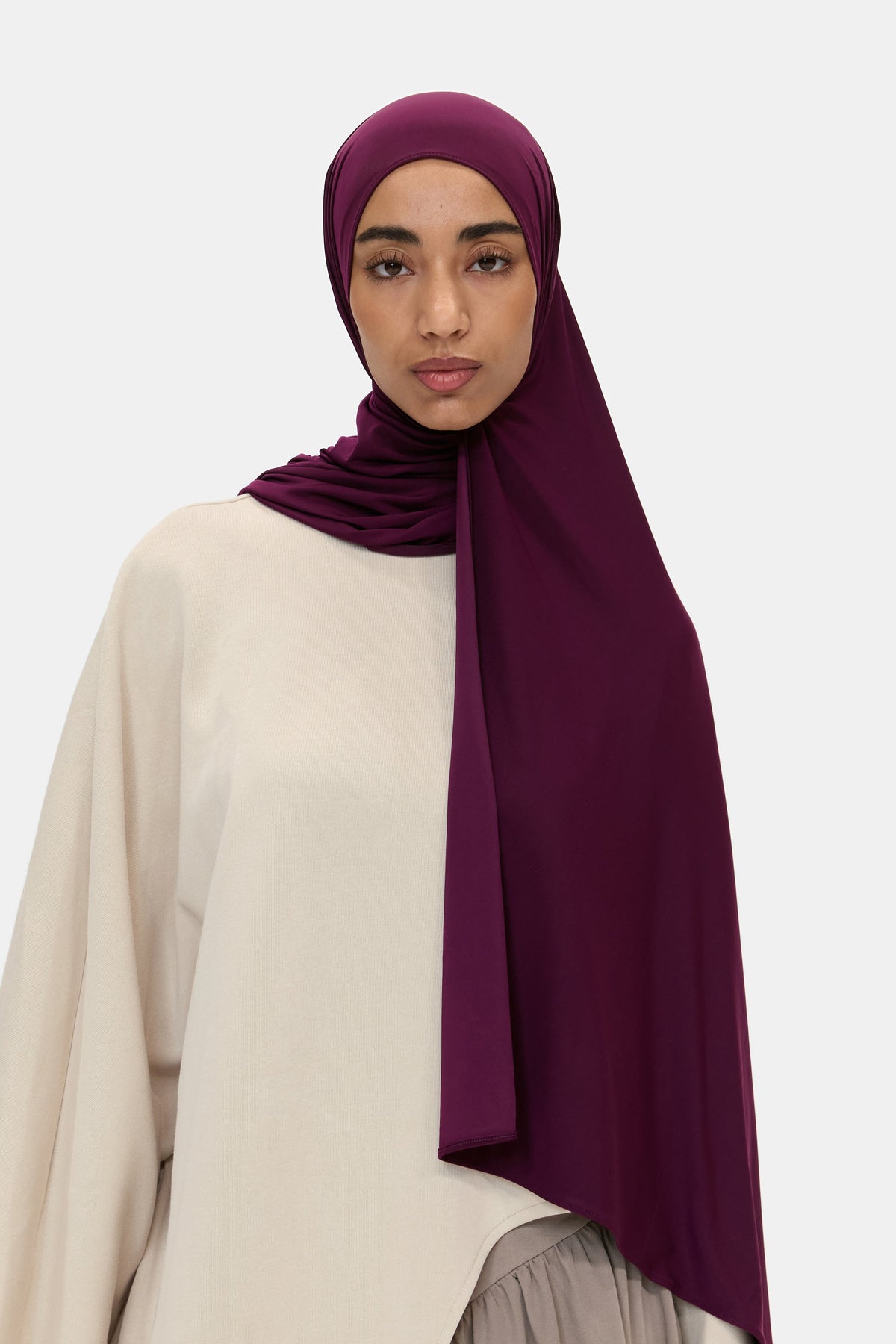 Model wearing the Airy Jersey Scarf in Deep Plum, front view