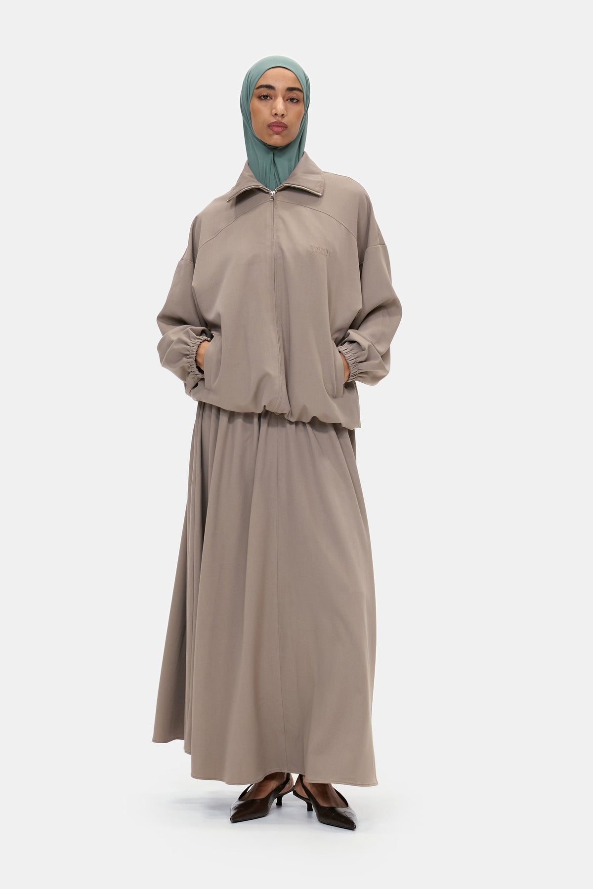 The Sculpted Maxi Skirt in Warm Taupe, worn with the Sculpted Jacket