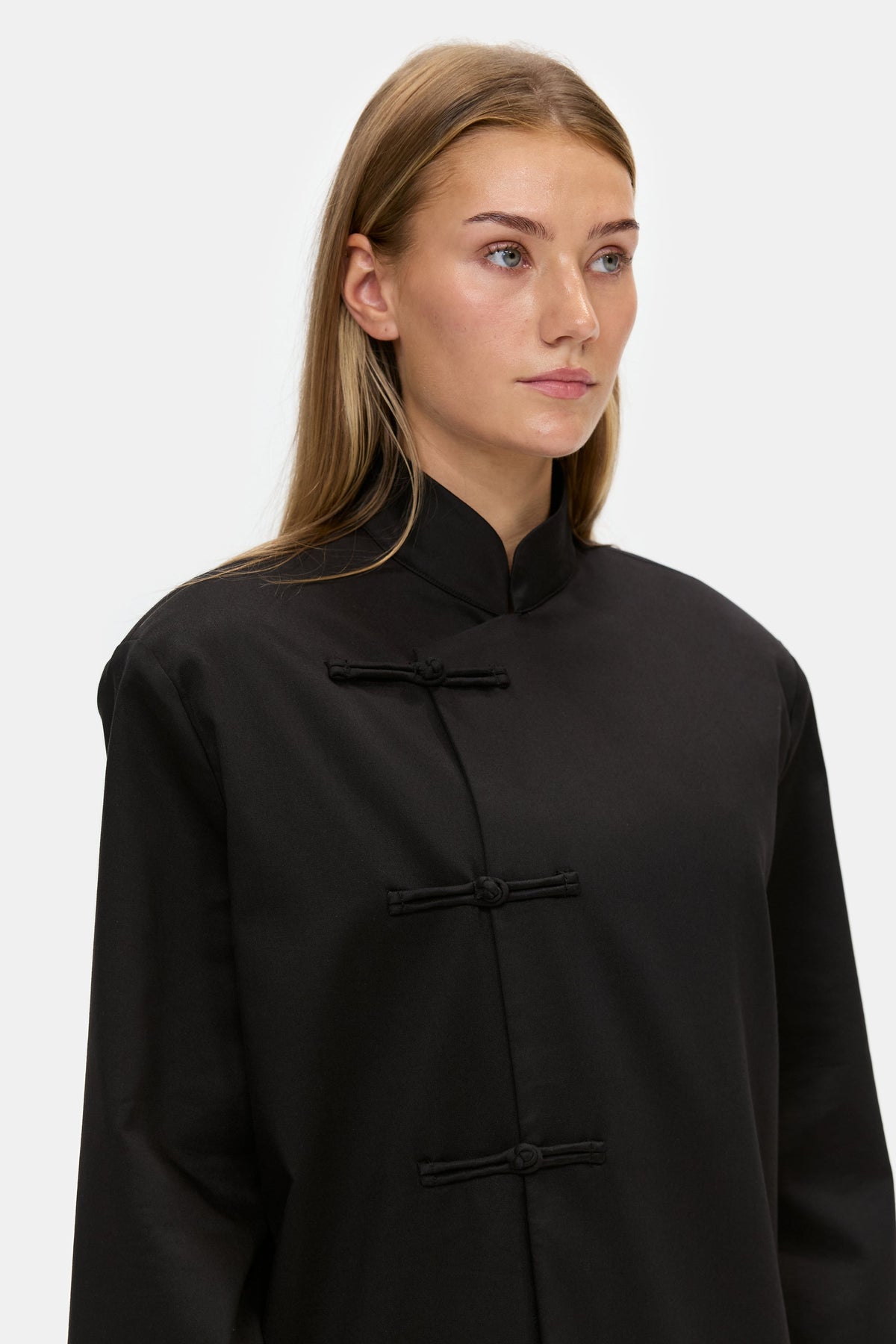 The Asymmetric Long Coat in Black, collar detail