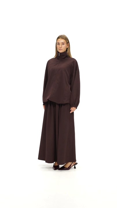 Model walking in the Sculpted Jacket and Sculpted Maxi Skirt in Chocolate Brown