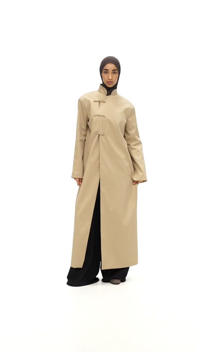 Model walking in the Asymmetric Long Coat in camel